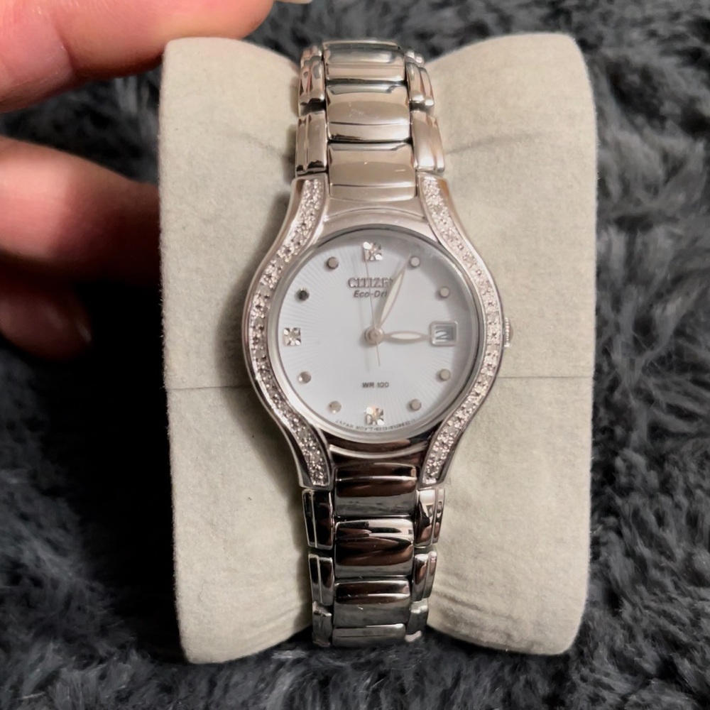Citizen eco watch with bezzled diamonds on the sides.